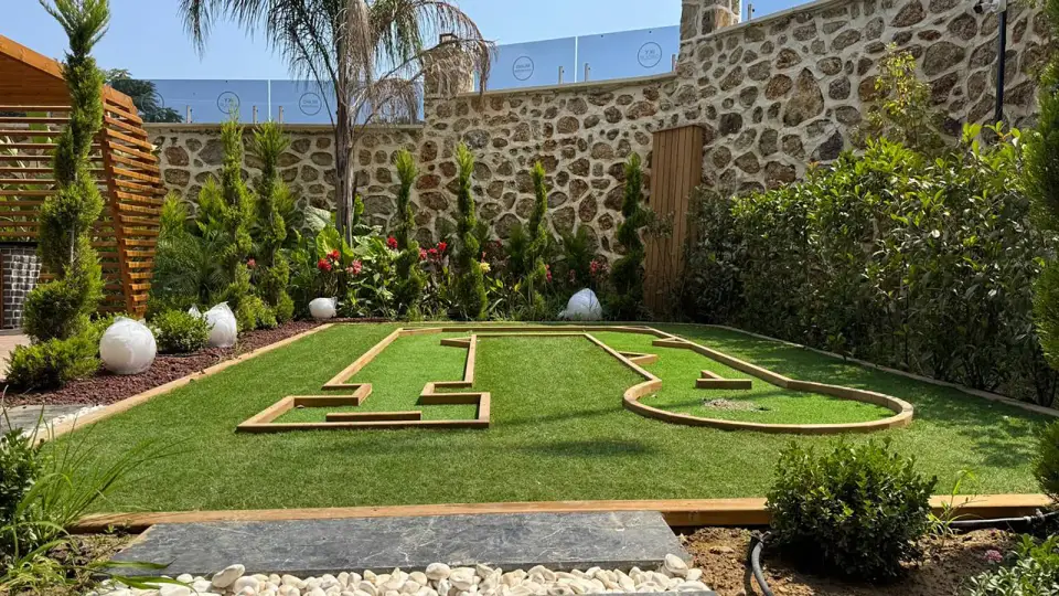 Mini-golf in the garden of the complex