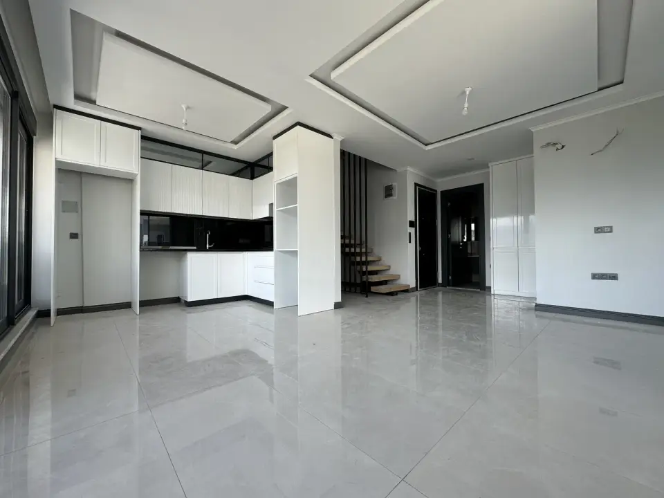 Living room with a kitchen in a finished apartment