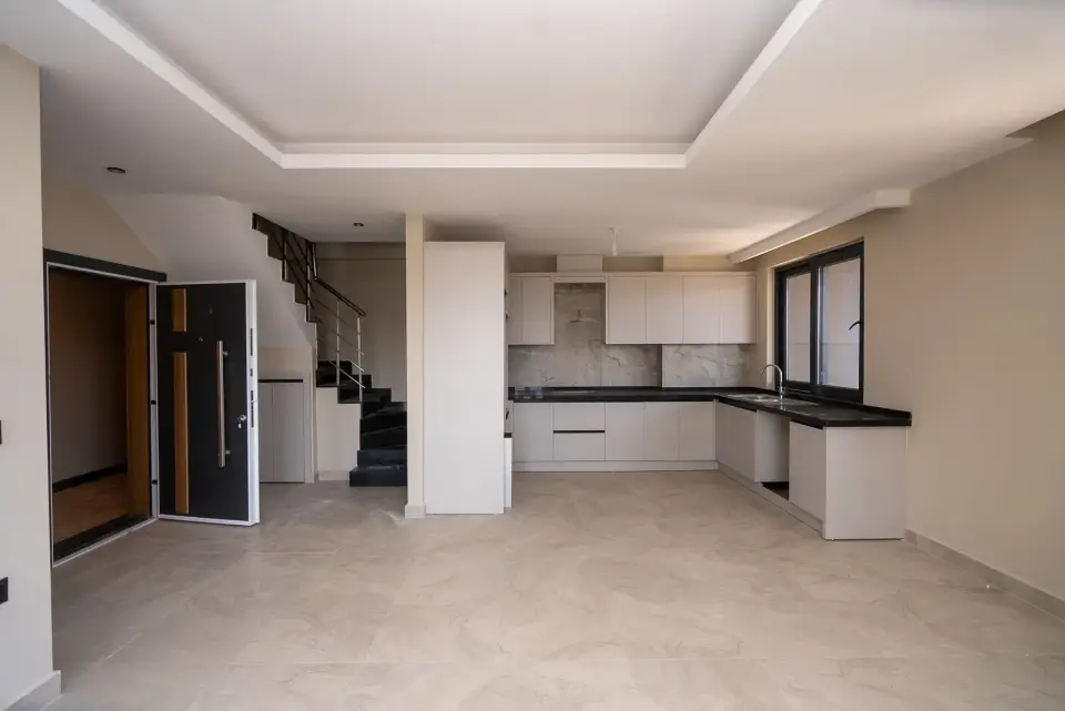 A penthouse: living room, kitchen and a staircase up