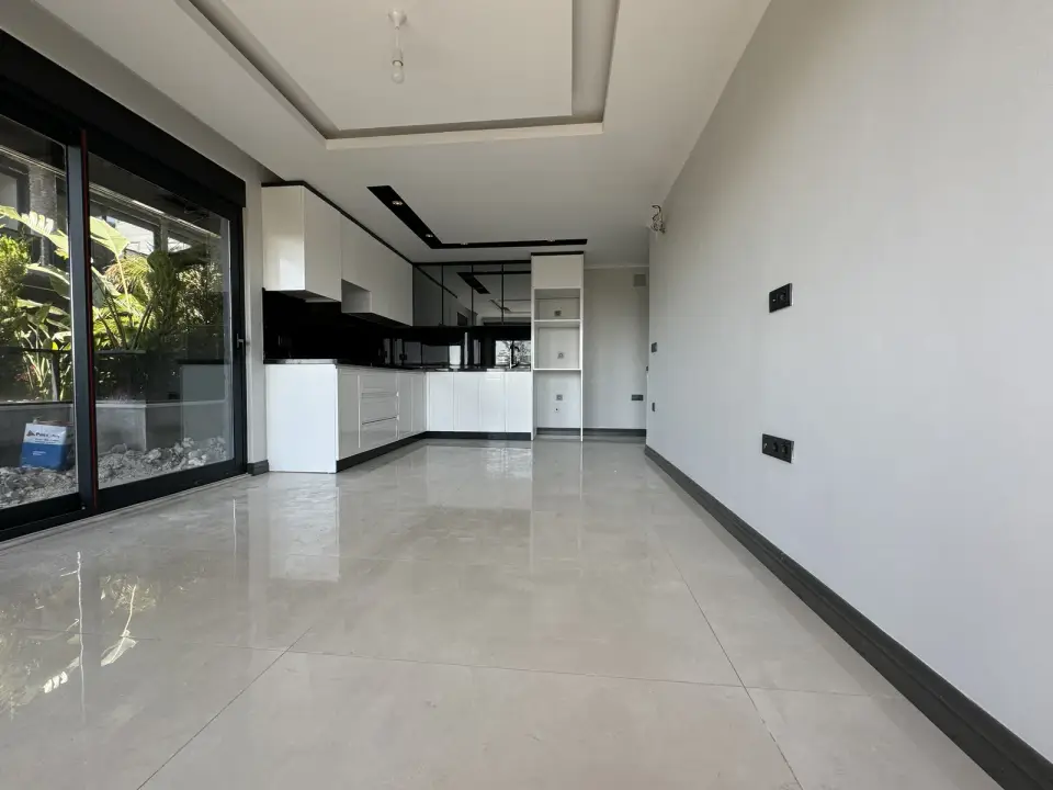 Living room and kitchen with large windows