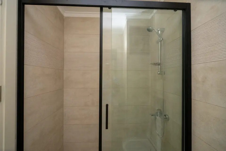 A bathroom with a shower cabin